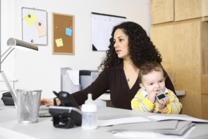 Work at home mom sitting at desk